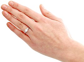platinum round diamond engagement ring on finger
