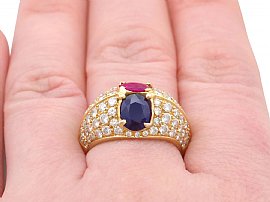 wearing a ruby and sapphire ring