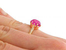 yellow gold ruby ring on finger