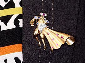 diamond and gemstone matador brooch wearing 