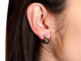black pearl earrings with diamonds wearing 