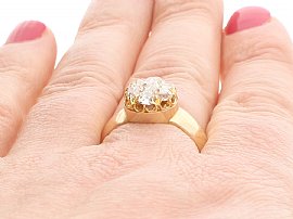 wearing gold ring on finger