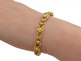 20 Carat Gold Bracelet with Pearls on wrist