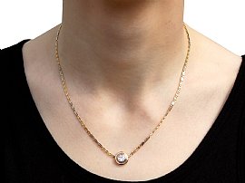 Bezel Set Diamond Pendant in Gold Wearing