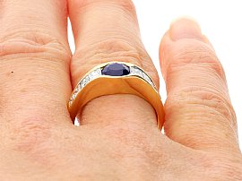 sapphire and diamond ring on finger