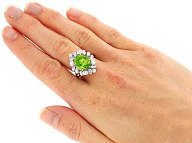 Wearing Oval Peridot Engagement Ring with Diamonds