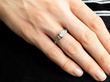solitaire diamond ring on finger