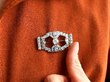 wearing Art Deco diamond platinum brooch