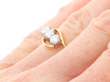 Trilogy Twist Ring in Yellow Gold on finger