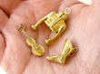 Antique Gold Bracelet Charms in hand