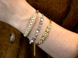 gemstone bracelets stacked on wrist