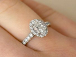 white gold halo ring on finger