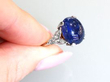 Burmese sapphire and diamond platinum ring on finger