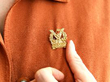 gold brooch wearing