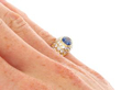 Oval Cut Sapphire and Diamond Ring on hand
