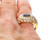 Oval Cut Sapphire and Diamond Ring being worn