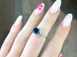 Blue Sapphire and Diamond Twist Ring on finger