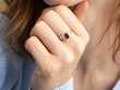wearing a garnet ring