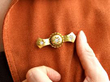 diamond gold brooch being worn