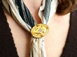 wearing diamond gold brooch