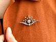 wearing diamond brooch