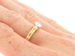 bezel set diamond engagement ring on hand