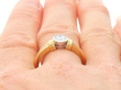 bezel set diamond engagement ring on finger