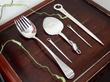 a selection of silver flatware