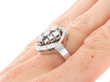 white gold diamond cluster ring on finger
