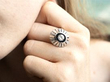 wearing a white gold and onyx diamond ring