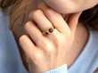 garnet gold ring on finger