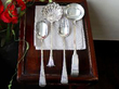 a selection of silver flatware