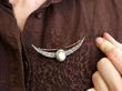 wearing opal diamond brooch