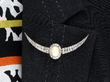 wearing opal diamond crescent brooch