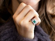 wearing emerald ring