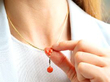 Wearing Coral Gold Necklace