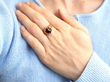garnet rose gold ring on hand