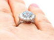 white gold blue topaz ring on hand