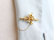 yellow gold brooch wearing