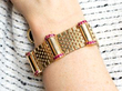 wearing ruby and gold bracelet