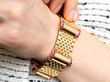 wearing ruby yellow gold bracelet