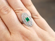 wearing emerald and diamond ring