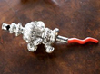 silver baby whistle and rattle