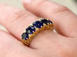 sapphire 5 stone ring on finger