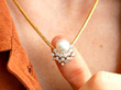 wearing pearl and diamond necklace