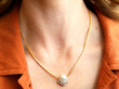 pearl and diamond necklace being worn