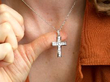 diamond cross pendant being worn
