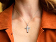 wearing diamond white gold cross pendant