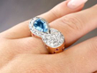 aquamarine diamond ruby ring on finger