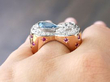 aquamarine ring on finger